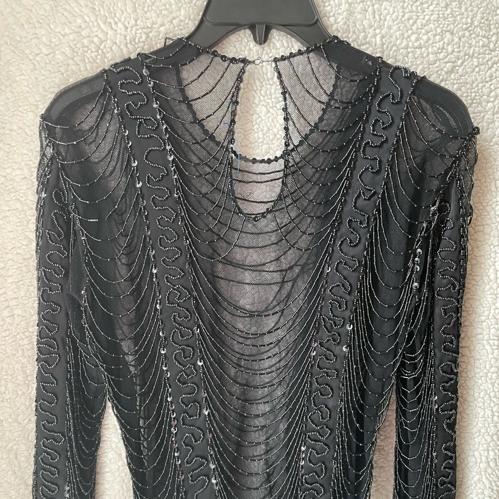 Beautiful and transparent black blouse embroidered in beads
